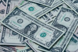 News Close-up image of stacked US dollar bills representing wealth and finance.